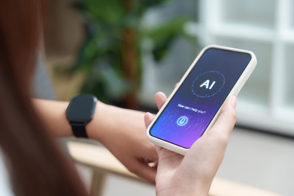 Person using an AI assistant app on a smartphone with a virtual voice interface and wearable smartwatch technology