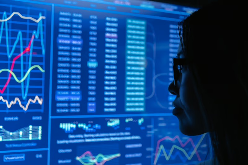 Business analyst reviewing an AI-powered customer analytics dashboard to improve personalization, customer experience, and data-driven decision-making.